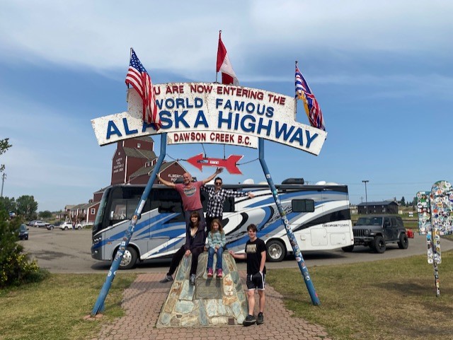 Mile 0 on the Alaskan Highway as we RV to Alaska